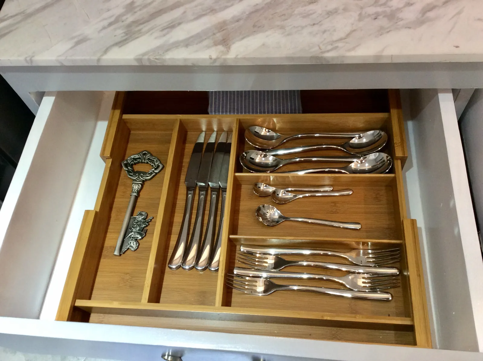 Cutlery arranged inside the drawer