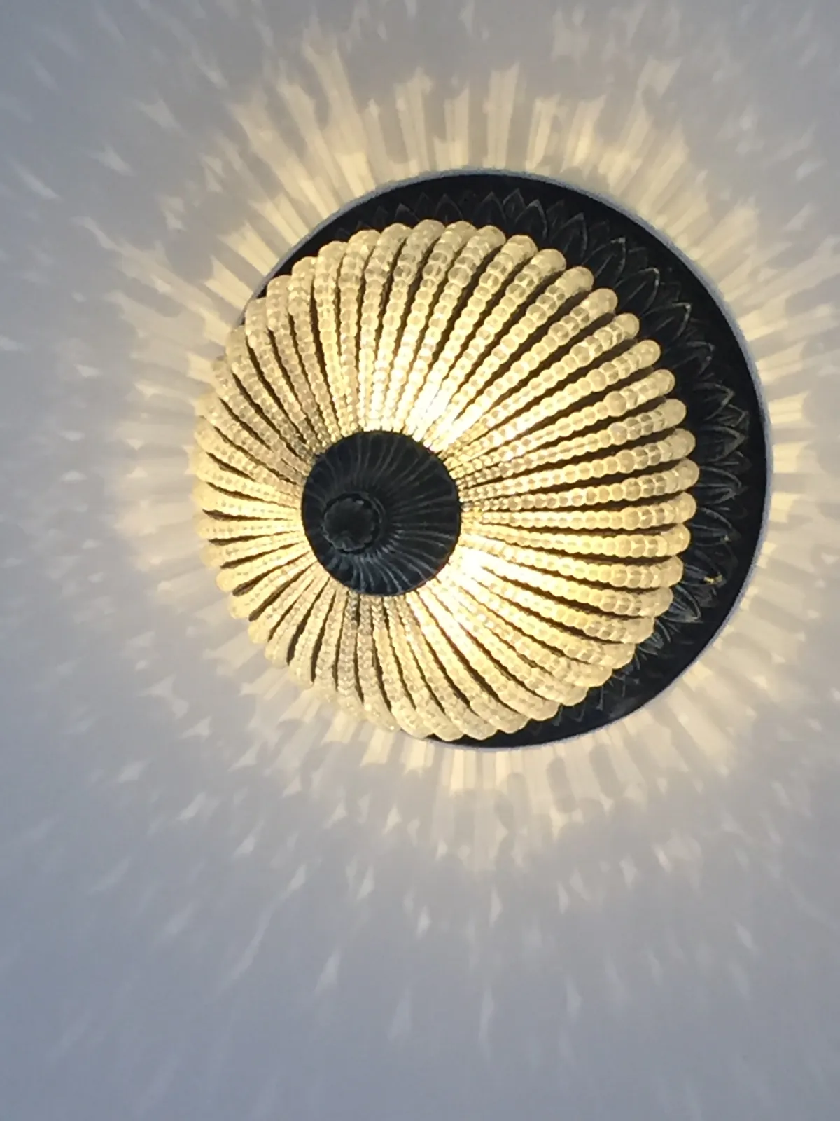 A light fixture casting a patterned glow