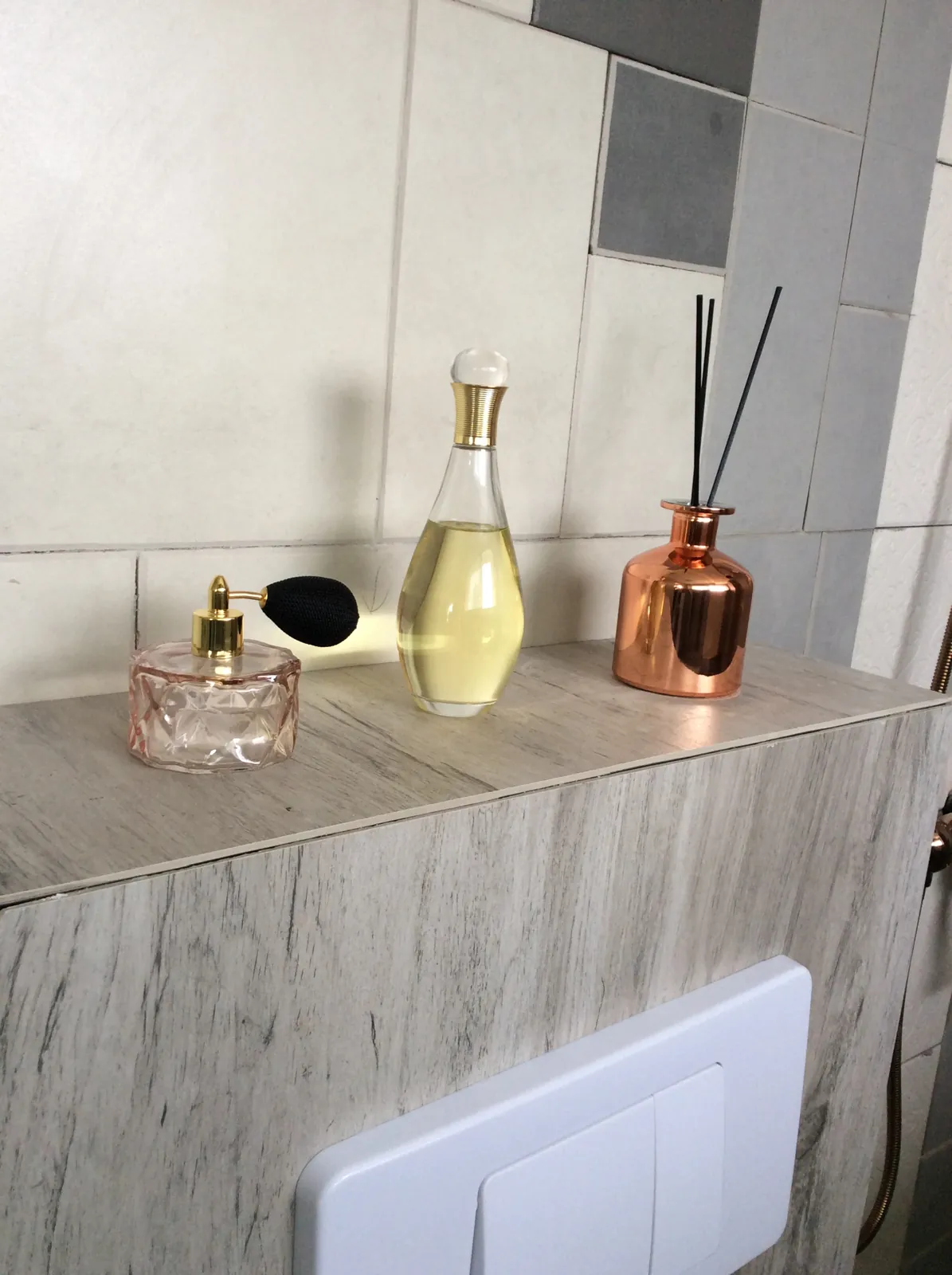Toiletries arranged on the ledge